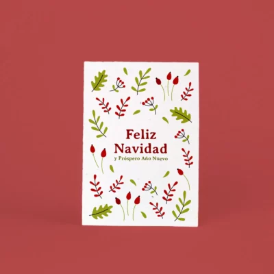Postal plantable Feliz Navidad y Próspero Año Nuevo con ilustración de hojas y bayas